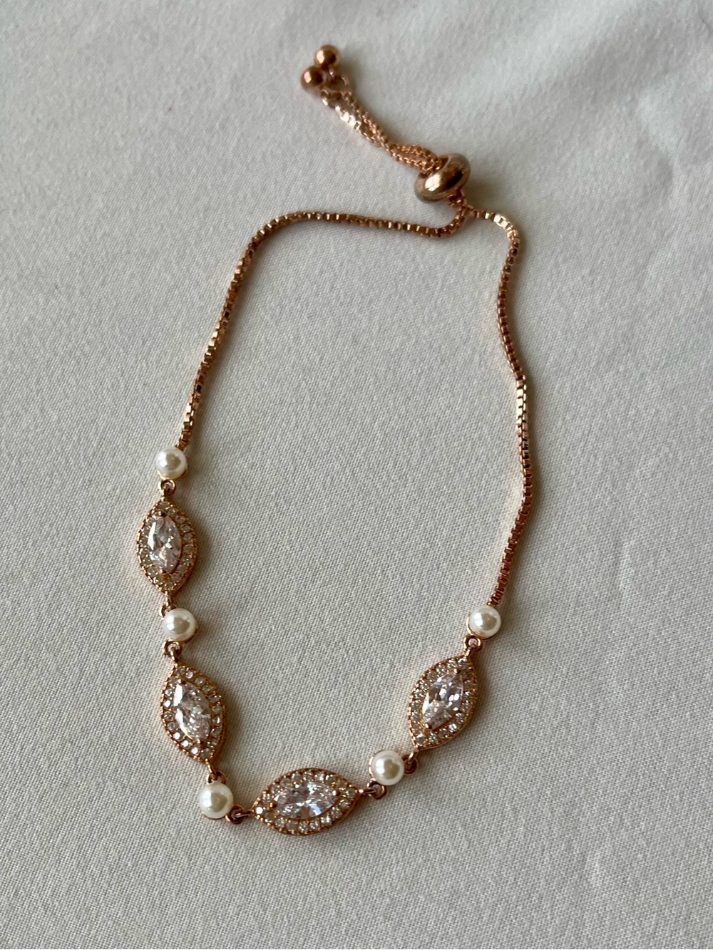 David's Bridal Rose Gold Tone CZ & Faux
Pearl Adjustable Bracelet